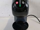 an image of a black coffee maker on a table
