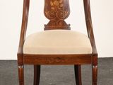 an image of a wooden chair with a beige upholstered seat