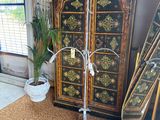 a tall cabinet in the corner of a room