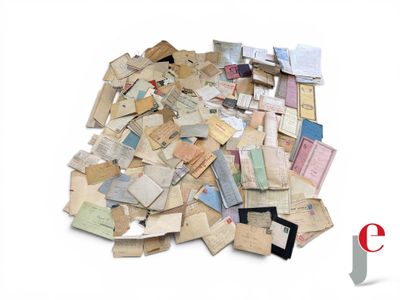 a pile of old letters and papers on a white surface