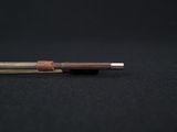a close up of a wooden pen on a black surface