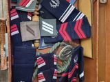 a suitcase full of ties and other items in it