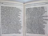 an open book with a black and white image of a man ' s face on it