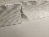 a piece of plastic covering a window in a room