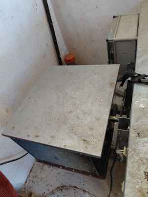 a stove that is sitting in the corner of a room
