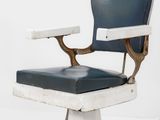 an image of a blue and white barber chair