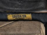 a close up of a baseball glove with a name tag on it