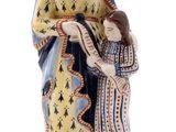 a figurine of a woman holding a child in her arms