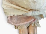 a close up of a pair of wooden legs with a cloth covering them