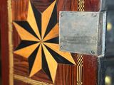a close up of a wooden door with a star design on it