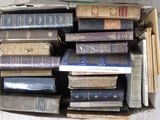 a box full of books sitting on the floor