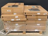 boxes of computer equipment are stacked on a pallet in a warehouse