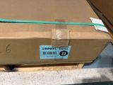 a cardboard box with a green ribbon on top of it
