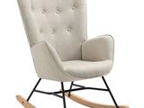 a white rocking chair with black legs and a beige upholstered seat