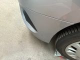 a close up of a car ' s tire on the side of the road