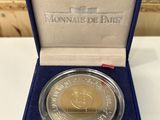 a close up of a coin in a box on a table
