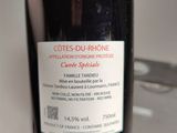 a bottle of wine being held by a person