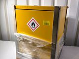 a yellow box that is wrapped in plastic and sitting on a table