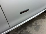 a close up of a car door with a sticker on it