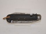 a small knife that is laying on a table