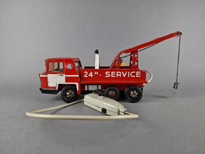 a toy fire truck with a hose attached to it