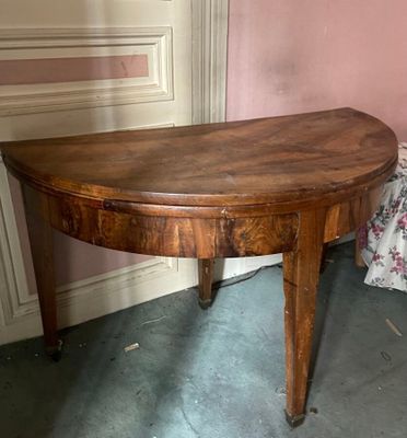 a small table with a wooden top in a room