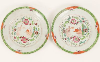 pair of chinese famille plates decorated with flowers and birds
