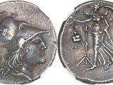 a close up of a silver coin with an image of a man on it