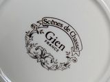 a close up of a plate with a design on it