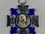 an image of a medal with a picture of a man on it