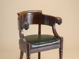 an image of a chair with a leather seat on a beige background