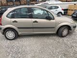 a small car that is parked in a parking lot