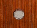 an overhead view of a wooden surface with a round hole in the center