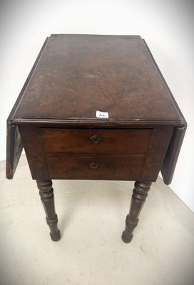 an old wooden table with a drawer on top of it