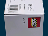 a box of legos sitting on a blue surface