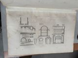 a picture of a drawing of a building on a table