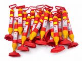 six red and yellow fire extinguisors are lined up on a white surface