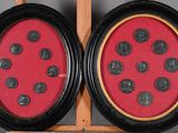 two framed pictures of a ladybug on a table