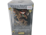 a box with a figure of a dragon inside of it