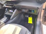 a car dashboard with a yellow sticker on it