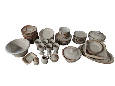many different types of dishes and bowls on the table