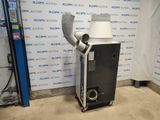 a machine that is sitting in front of a wall