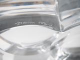 a close up of a glass of water with a label on it