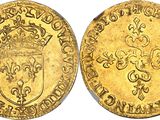 a gold sovereign coin with a crown on it