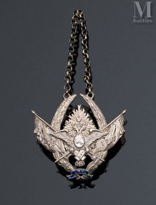 an image of a silver necklace with a blue stone in the middle of it