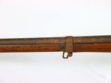 an old rifle with a wooden barrel and a metal handle