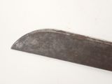 a large knife that is sitting on a table