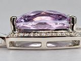 an amethorate and diamond pendant on a silver chain