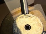 a close up of a metal object on a table