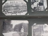 an old photo of a book with pictures of buildings and a fountain